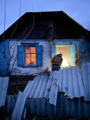 A picture of a house with a temporary replacement window