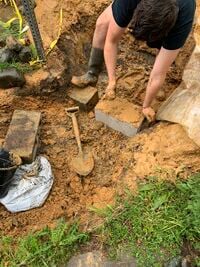 Image 7. Pack in the cinder blocks with rocks, gravel, and clay-- seal and build it all with a clay mixture.