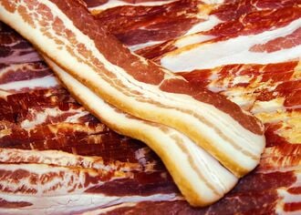 Raw pork belly slab with skin attached