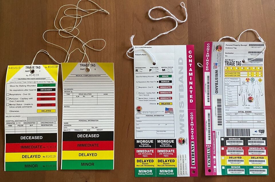 Front and back of two different types of START triage tags