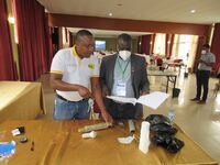 ETALO Team Lead shows an orthopaedic surgeon how to use the self assessment form.