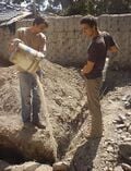 Fig:7 It is important to first moisten the ground before laying cement down on it. This is because this way the cement really becomes part of the earth.