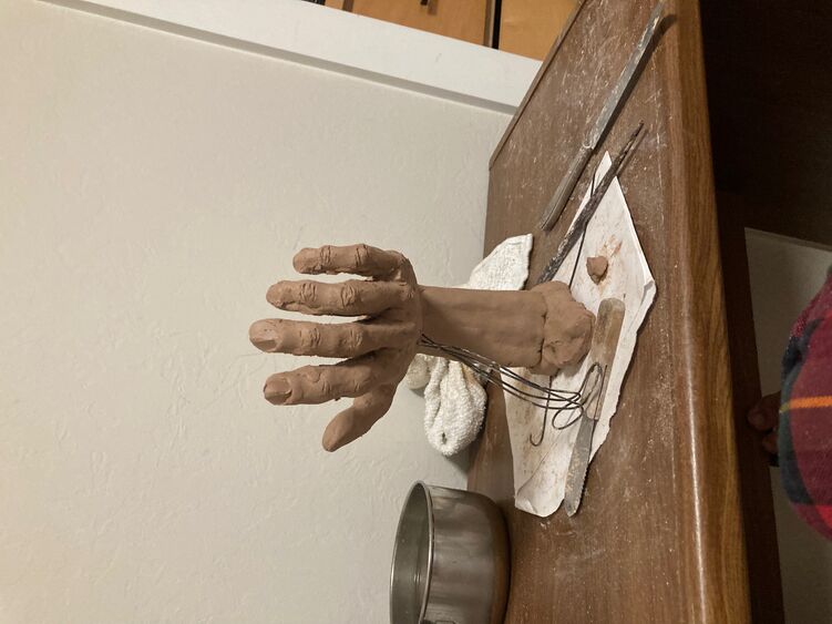 File:TeamEggClayHand.jpg