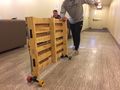Testing the portability by use of skateboard trucks to help move the stage.