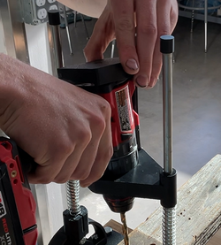 Student places cap on top of the drill