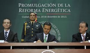 Mexican President Enrique Pena Nieto signing the Energy Reform Act in 2013. The bill came into effect in 2014.
