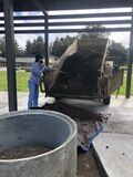The soil was removed from the trailer and placed into the planters.