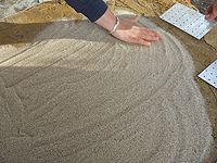 Spreading fine sand for the firebricks.jpg