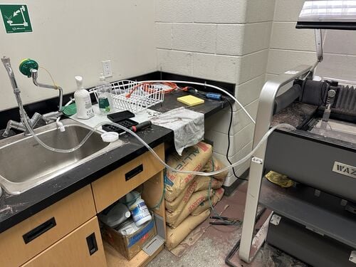 Water fill hose placed inside the WAZER tank.