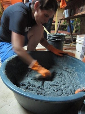 Figure-2: Mixing the plaster in the big bucket before distributing to smaller ones.