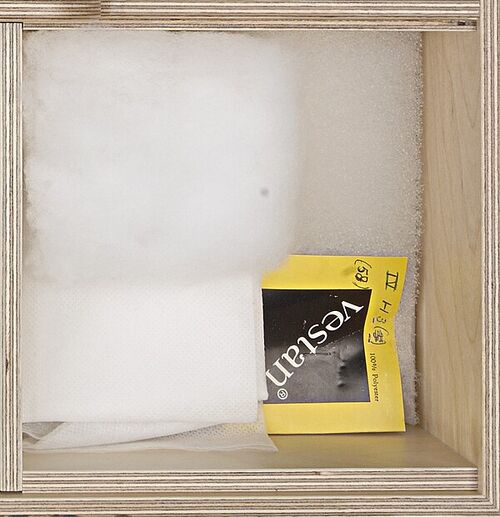 Cut polyester fiberfill displayed in a textile museum cabinet
