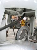 An exercise bike is substituted for the original 2hp 110v electric motor. A fan-belt is rapped around the flywheel of the exercise bike and a pulley which drives the original transmission of the Wringer Washer.