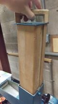 Weight used to push material into rotary blades, or held with screw to increase mill chamber capacity