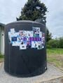 spray painting "Non-Potable" on the storage tank