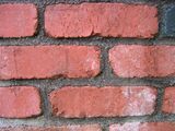 Here is an example of a brick wall made with concrete mortar.