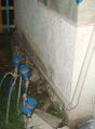 Water overflow outlet directing extra water toward street drain.