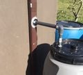 Use nipples and bulkheads to connect the downspout to the lid of the first tank