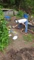 Luisa spray painting rocks for buried irrigation lines