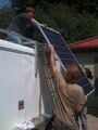 Fig 4: HSU students hoisting up the PV panels