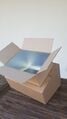 Insert the inner box through the base of the outer box.