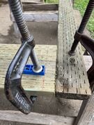 Clamped drill guide along cornered line.