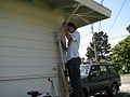 Figure 7: Fitting and finding appropriate length of gutter from downspout on eave to wall of house.