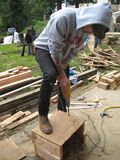 Greg drilling holes in the sides of the wooden boxes for our test bricks