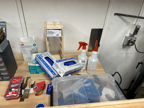 Disorganized PPE equipment on a workbench in the Cal Poly Humboldt Makerspace