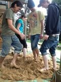Fig 8:Mixing the mortar with a native dance.