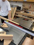 Figure 5: Cutting a piece of wood that will be used as a support beam in one of the cabinets using a table saw. (A.A.I.R. Tech 2025)