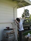 Figure 10: Fitting the crimped gutter into the first downspout.