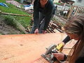 Cutting the slabs of wood with the hand saw