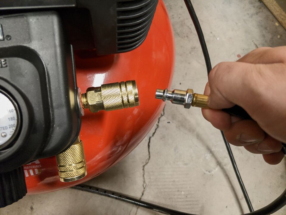 File:MOST AboutToConnectHoseToAirCompressor.jpg
