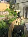 Fig 1a: Brandon laying tubing to correct bed length