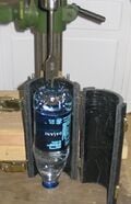 Fig 3. Placing the bottle in the brace.