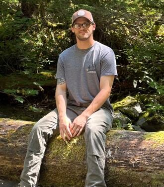 Me sitting on a log.