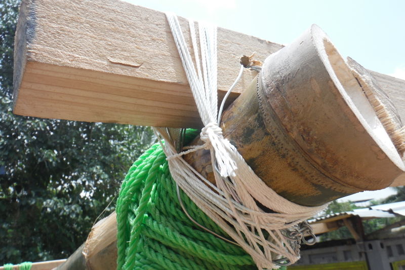 File:Lashing bamboo wire.jpeg
