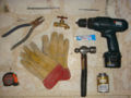Drill, cement drill bit, PVC cement, 6" nail, silicone glue, hammer, pliers and wire cutter, tape measure, faucet and gloves.