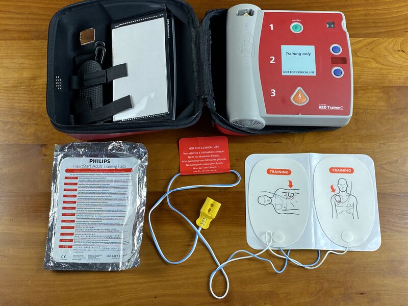 File:FCEMT AED trainer with adult pads.jpg