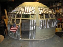 Aluminum Awareness Aluminum can shingles and 2-liter bottle windows
