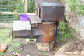 Forest biochar rocket stove with cooking module side view.png