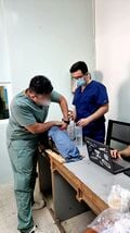Expert applying a tourniquet as part of the validation of our simulator
