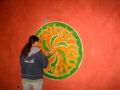 Students at Cal Poly Humboldt use egg paint to create this logo for the interior wall of the Campus Center for Appropriate Technology.[12]