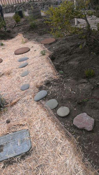 File:Stepping stones on weed mat.jpg