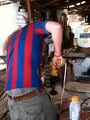 Fig. 1c: Robert drilling hole for mesh bottle