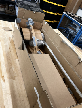 Prototyping Tsunami Wave Tank Demo with cardboard as the material within a to-scale cardboard box representing the tank.