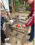 This image shows us attaching the motor to our first screen prototype.