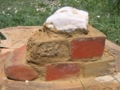 fig 7e: Brown clay from jar 2 used as mortar. We call this wall: test-wall 2