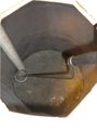 Figure 1: Inside of waste barrel showing pump sleeve, barrel liner, grate, and stir rod.