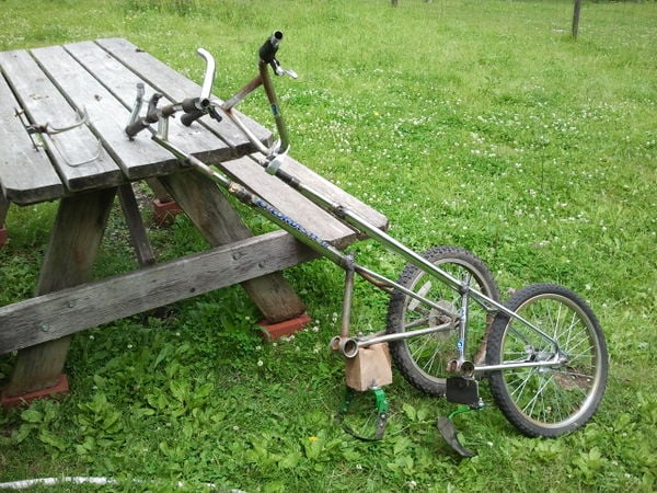 Two wheel hoes created from discarded small bicycles